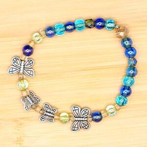Butterfly Charm and Multi shades of Blue Glass Barrel Beaded Vintage Bracelet